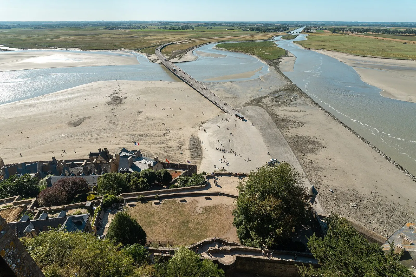 Footbridge approaching Mont Saint-Michel across the bay